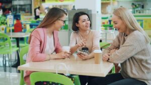 Friends sharing a warm, candid conversation over coffee