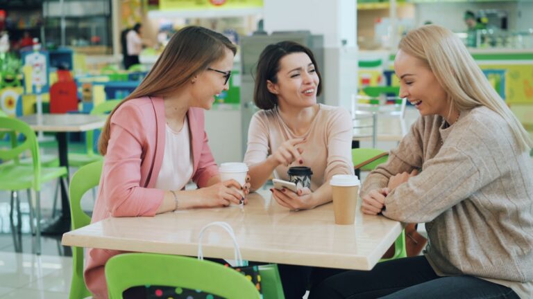 Friends sharing a warm, candid conversation over coffee